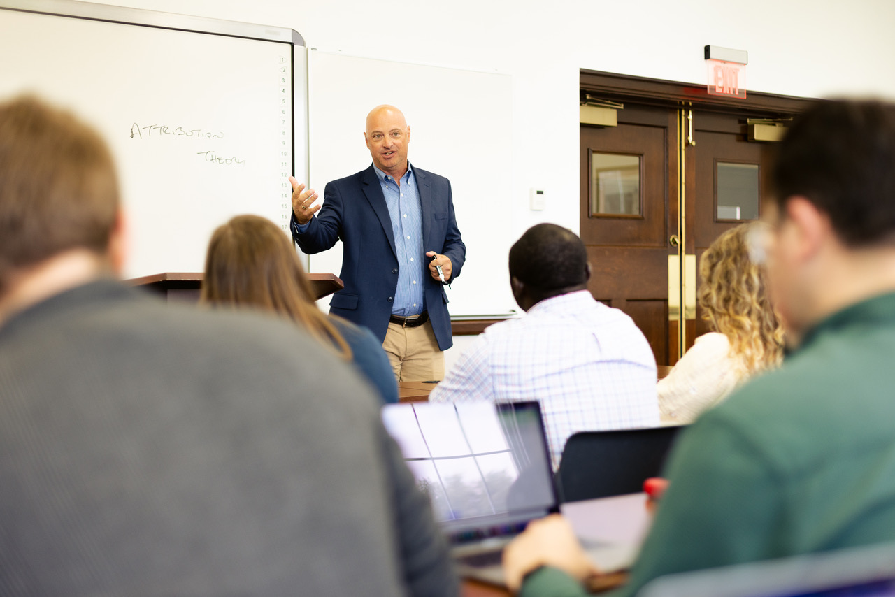 Dr. Bosch teaching in classroom