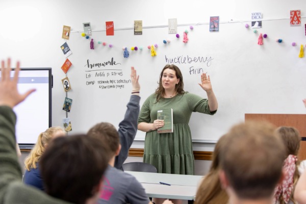Female teacher in classroom with students