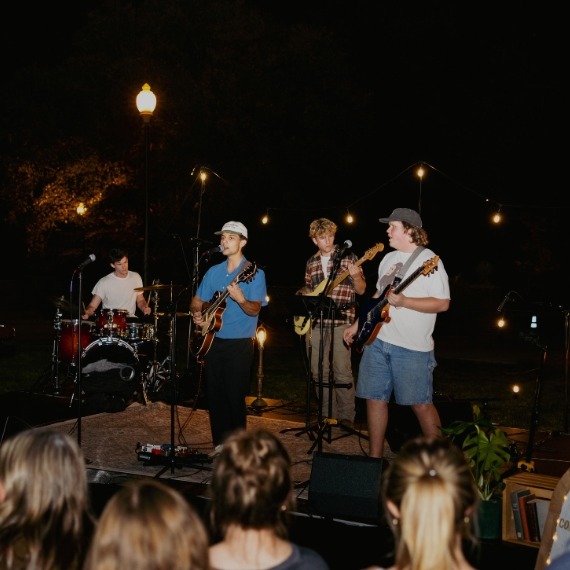 Student band performing outside at night