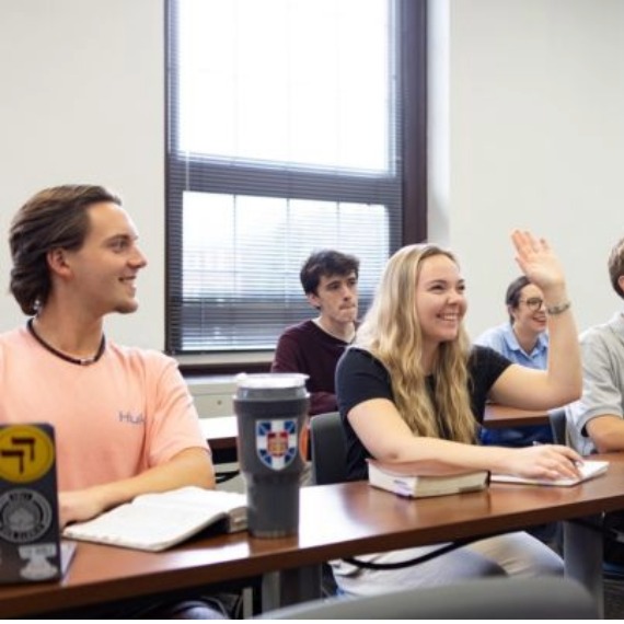 Female Boyce student raising hand in class
