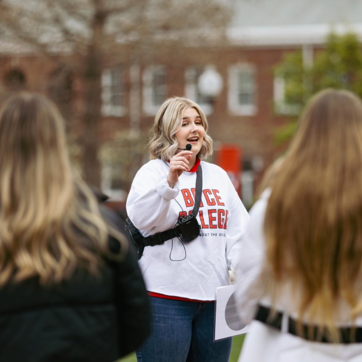 Admissions counselor leading tour