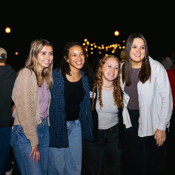 Four females posing for a phot at Be a Bulldog Day