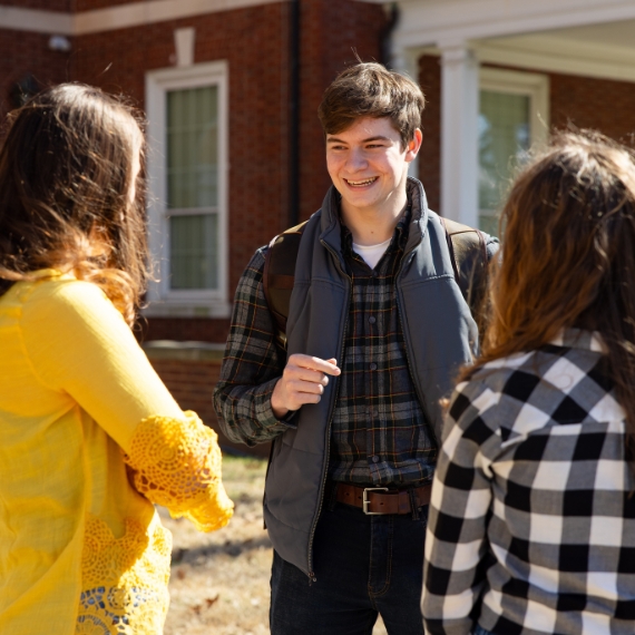 Student talking outside