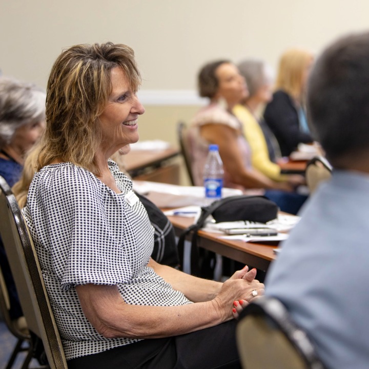 Dr. Tucker listening to conference speaker