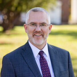 Faculty headshot of Justin A. Irving
