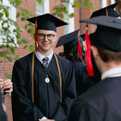 Boyce grad in cap and gown