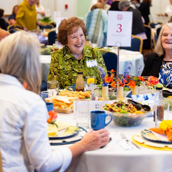 Women laughing at luncheon