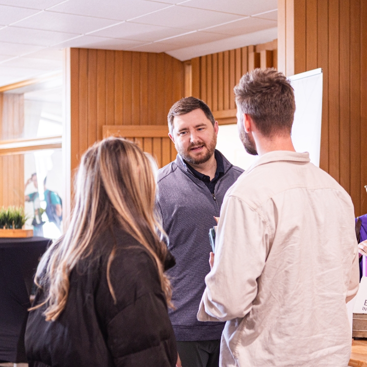Terry Lee talking with students