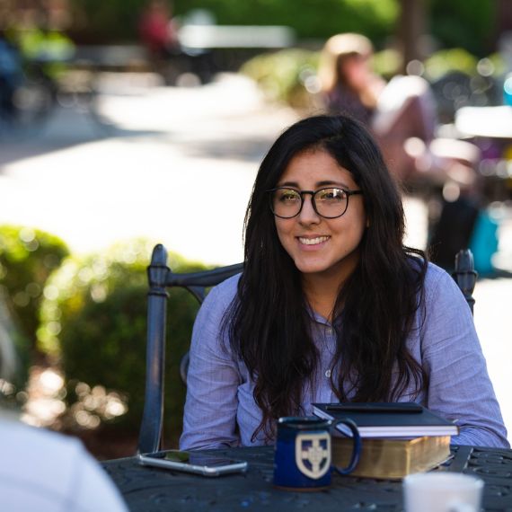 Female student talking with friend
